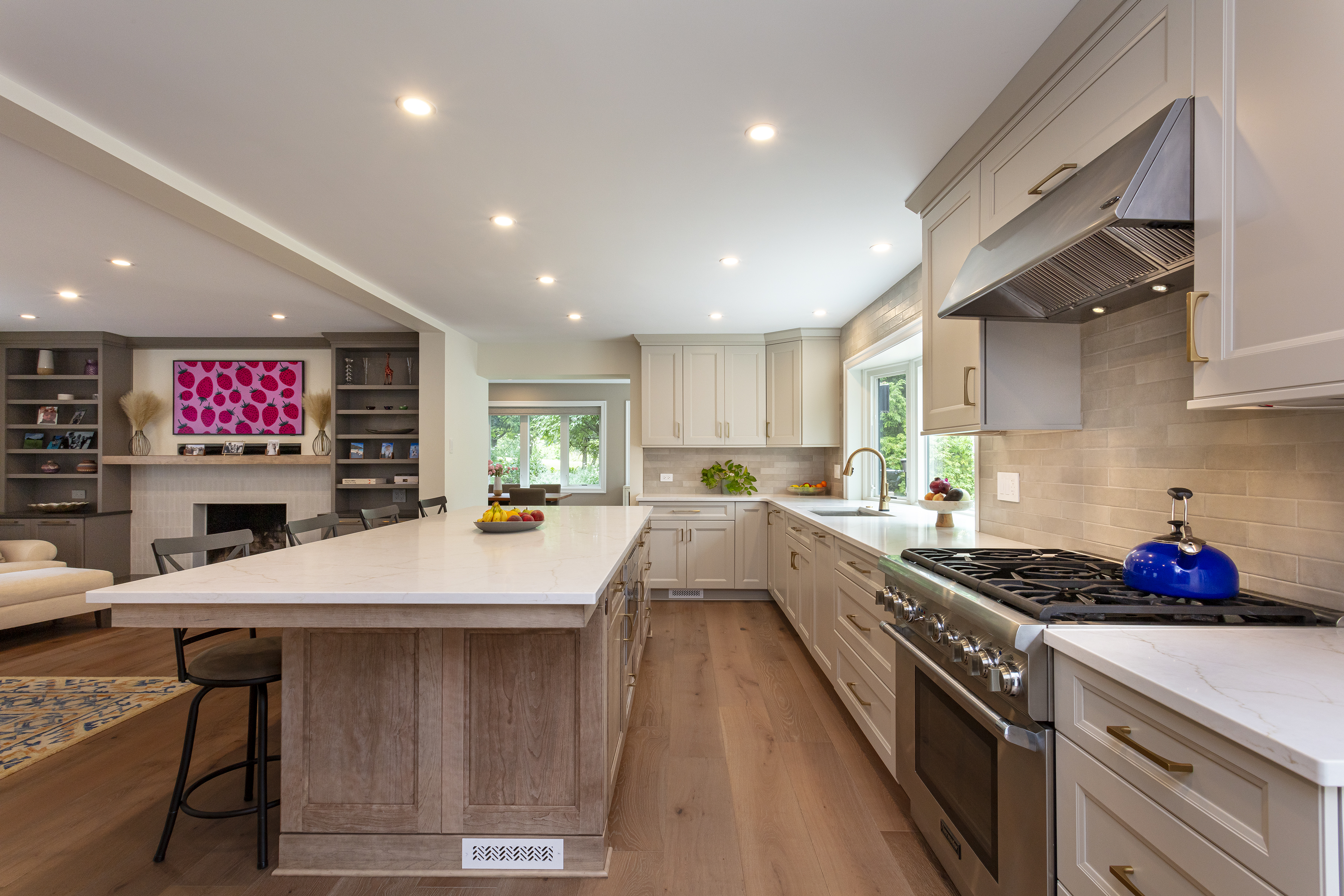 Chef's kitchen with white-oak island and pro range