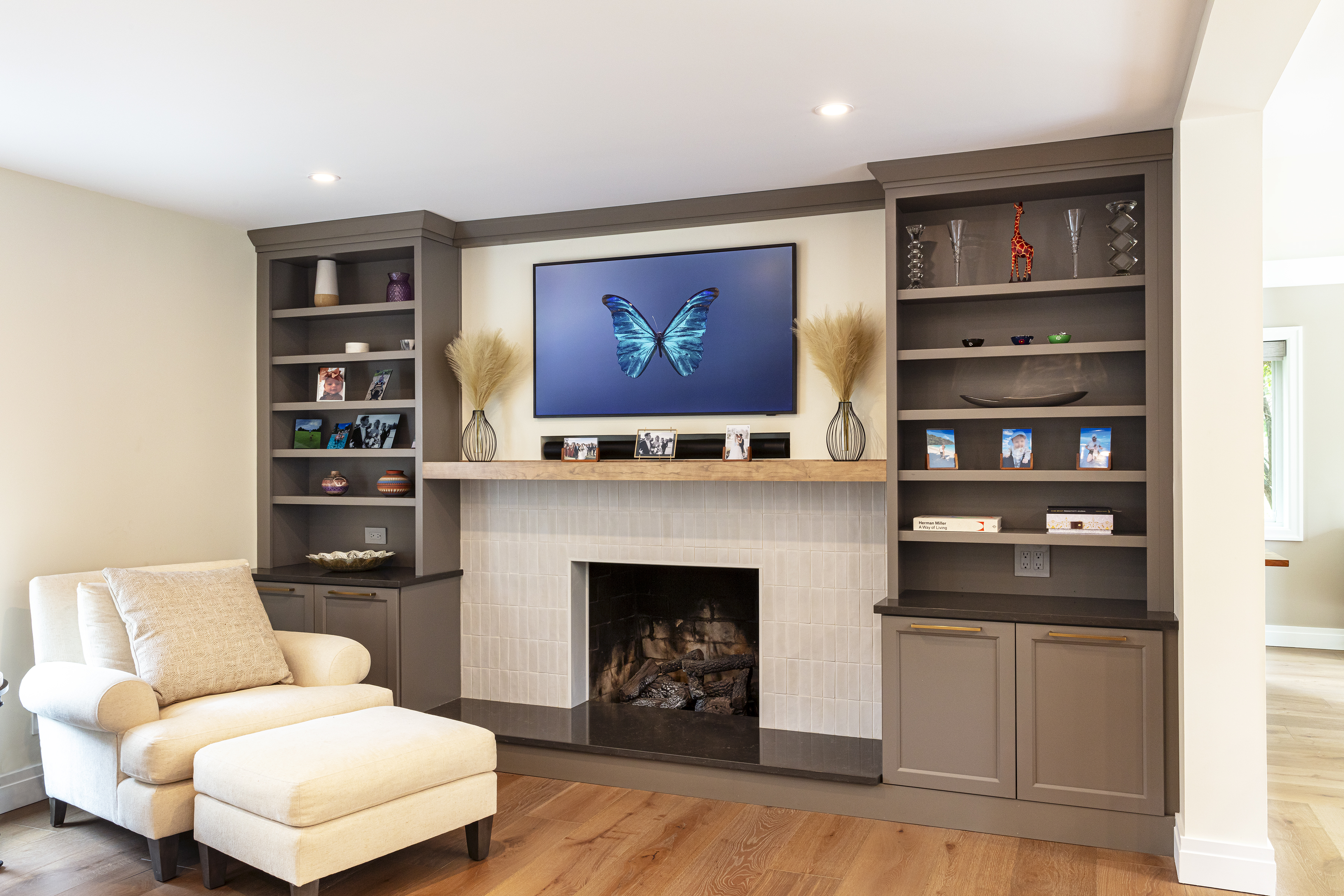 Custom built-ins flanking a tiled fireplace
