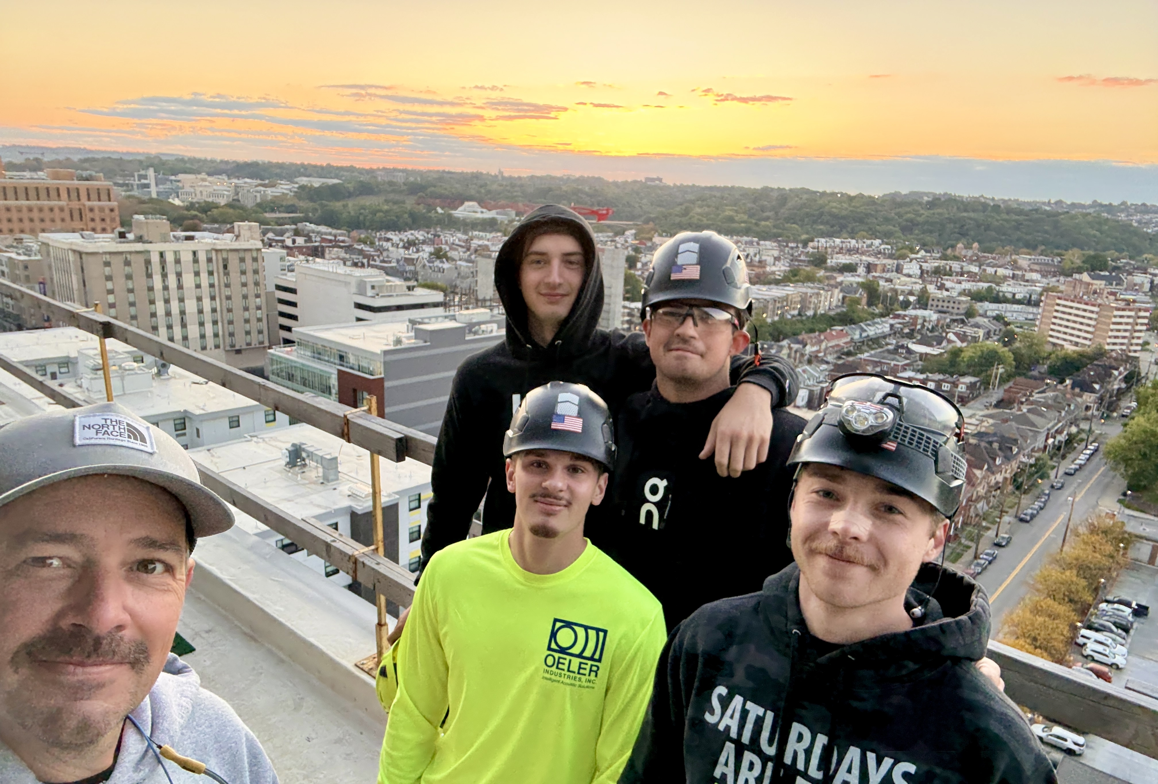 The 40 North Renovations crew overlooking Pittsburgh at sunset